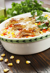 Chicken legs baked with rice and vegetables