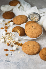 Oatmeal cookies handmade, Oatmeal Flakes, Raisins on a light background. Breakfast Concept