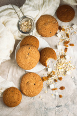 Oatmeal cookies handmade, Oatmeal Flakes, Raisins on a light background. Breakfast Concept