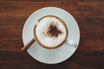 Coffee cup on wooden background