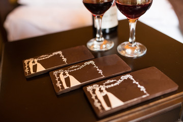 Three chocolate bars with the image of the bride and groom. Chocolate candy, tiles.