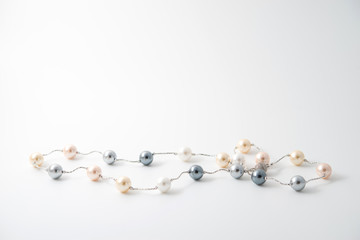 pearl necklace on white background