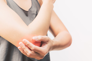 closeup women elbow pain/injury with red highlights on pain area with white backgrounds, healthcare and medical concept