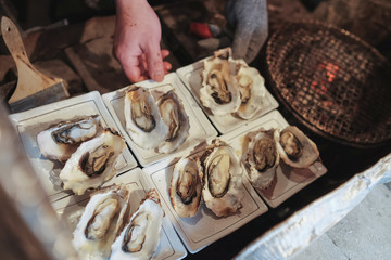 Chef grilled oysters meticulously. To serve tourists arriving at matsushima bay