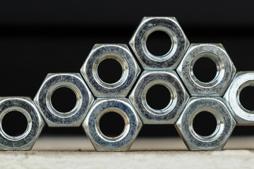 Many hex nuts