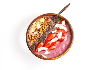 Vegan breakfast concept. Strawberry smoothie bowl with almonds, chia, sprouts and coconut, isolate, white background