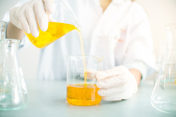 Oil pouring, Formulating the chemical for medicine,Laboratory research, dropping liquid to test tube