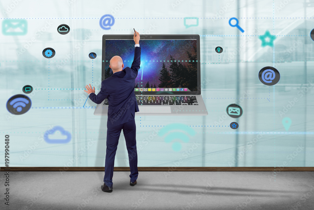 Poster businessman in front of a wall with a computer surrounding by app and social icon - 3d render