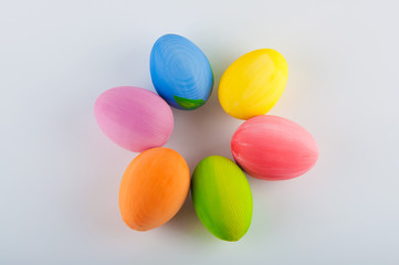 Fototapeta na wymiar Easter eggs laying in circle on white background