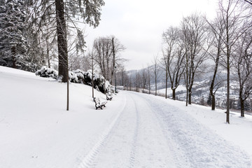 Naklejka premium Photo of snowy landscape covered with snow and road in winter