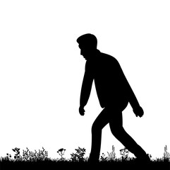 silhouette of man dancing on grass