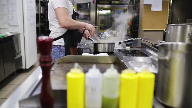 The process of cooking in the restaurant kitchen