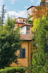 Bergamo, Italy. View of a tall ancient building with large windows.