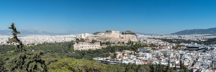 Fototapeta na wymiar Panoramic view of the Acropolis of Athens against blue sky, Greece.