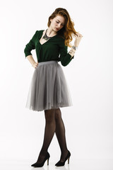 Full body portrait with a beautiful redheaded woman