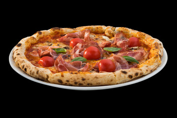 pizza with cherry tomatoes, basil and prosciutto isolated on black background