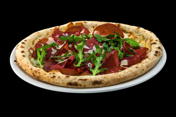 pizza with prosciutto and rucola isolated on black background
