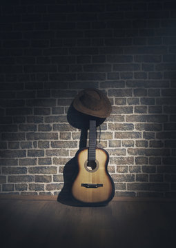 Hat cowboy and guitar and wall  brick light and shadow photo