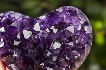 Amethyst geode on black background. Beautiful natural crystals gemstone.