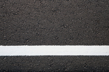 Asphalt road texture with white line