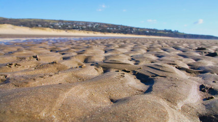 Perspective view of sand across a beach