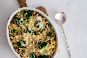 Pasta with vegetables, meat and cheese.