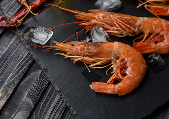 Raw fresh prawns langostino austral shrimp seafood with lemon and spices