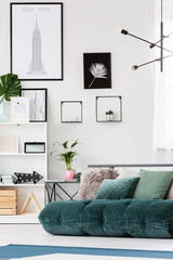 Posters in cozy bedroom interior