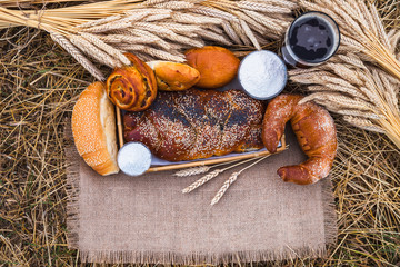 Fresh bread and a drink, bakery products closeup