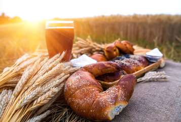 Fresh bread and a drink, bakery products closeup