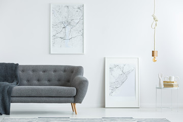 Elegant sofa and map posters