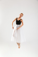 Naklejka premium Pretty young woman ballerina dancing gracefully