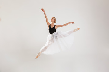 Beautiful young woman ballerina dancing