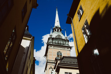low angle view of traditional houses and cathedral in Stockholm, Sweden