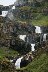 beautiful cascades of scenic waterfall and rocks in Eastern Iceland