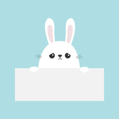 White sad bunny rabbit hanging on empty paper board template. Funny head face. Big ears. Cute cartoon character. Kawaii animal. Happy Easter. Baby card. Pet collection. Flat design. Blue background