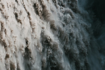 Fototapeta premium full frame of falling water in majestic powerful Dettifoss waterfall, iceland