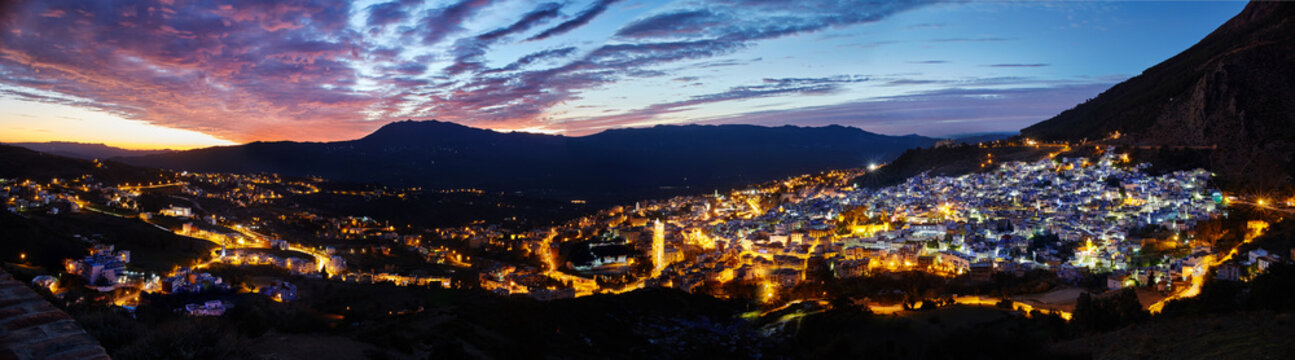 Panorama night city of Chefchaouen Morocco. Blue city in night lights. Journey through Morocco, magical place. Sunset over Chefchaouen, Morocco. Panoramic view of the city