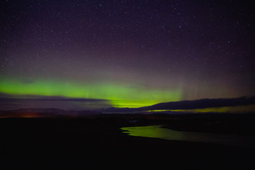 majestic view of night sky with northern lights and stars in iceland