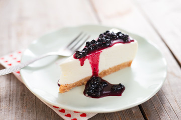 Blueberry cheesecake on wooden table