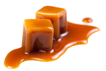 Golden Butterscotch toffee candy caramels. Sweets with copy space, macro. - obrazy, fototapety, plakaty