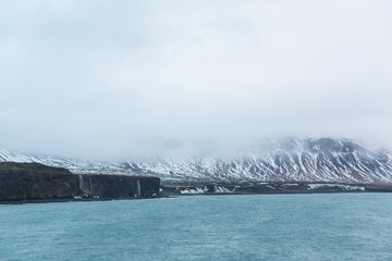 spectacular view of beautiful fjord and snow-covered mountains, iceland