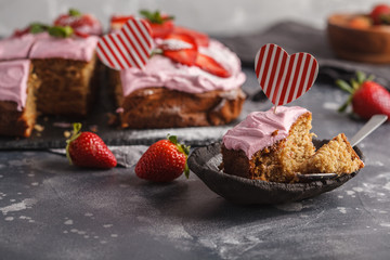 St.Valentine's Day Cake for breakfast with pink glaze and fresh strawberries. Dark background, berry dessert, copy space.