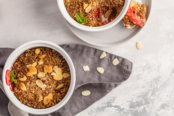 Homemade breakfast strawberry crumble. Mini berry cake with strawberry, macro,  light background, top view, copy space. Healthy vegan food concept.
