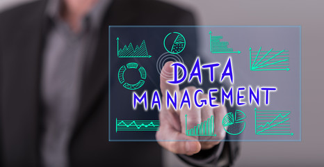 Man touching a data management concept on a touch screen