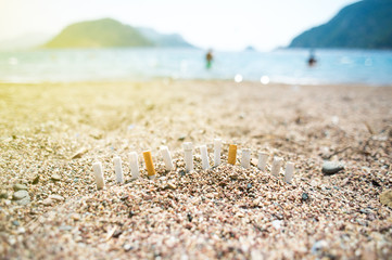 Fototapeta na wymiar cigarette butts on the beach