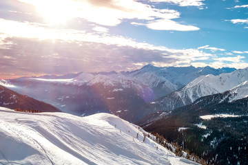 Early sunset at snowy winter landscape in mountains alps