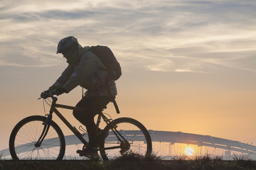 Cyclist Against Overcast Sky