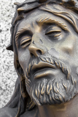 Fototapeta na wymiar Bronze statue of the face of jesus