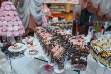 Delicious cookies and candies stand served on the table